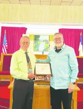 Antelope Baptist Church Pastor Will Aston, left, is presented a proclamation by the Harvest Baptist Association for his half-century at the pulpit of the church April 23, almost 50 years to the exact day he was chosen to be pastor. Courtesy photo