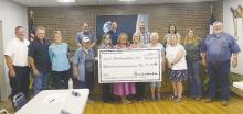 Members of the Friends of the Animal Shelter presented city officials with a check for more than $215,000 at the council meeting Aug. 14. The monies will go toward construction of the new shelter, which is coming along smoothly and is expected to be complete later this fall. Photo/Brian Smith