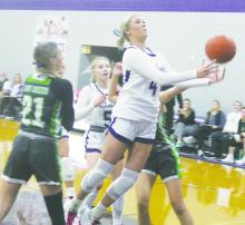 Jacksboro’s Hayden Walker (4) looks to put up a shot as she works her way through Iowa Park defenders after a drive into the lane. The Tigerettes suffered their third straight loss in District 7-3A play Tuesday, Jan, 16, with a 47-40 overtime setback to visiting Henrietta. File photo