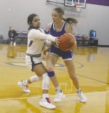 Jacksboro’s Lily Perez, left, goes for the ball defensively versus Windthorst in the Tigerettes’ 45-35 loss Tuesday, Nov. 28. Photo/Brian Smith