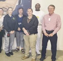 Cedric Fielder, back row, poses with Lindsey State Jail Community Relations meeting Jan. 31. Fielder, an inmate who is a life coach, spoke about a life skills program at the jail that he taught. The first class of 15 graduates finished the course recently. Courtesy photo