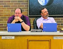 Alderman Joel Hood (left) asks a question concerning a zoning change during the Jacksboro city council meeting Monday, June 12. Photo/Brian Smith