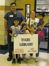 After r eading more than 2.7 million words and getting 485 AR points, Jacksboro Elementary 3rd grader Yogi Agarwal had the school library named after him for a day at the end of the school year. Agarwal is seen here with his family. Photo/Brian Smith