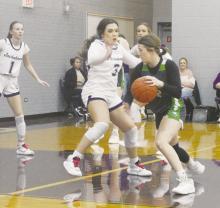 Jacksboro’s Landrie Valenzuela (3) defends the Iowa Park player during first half action of the game Monday, Jan. 8 with the visiting Lady Hawks. The Tigerettes let a halftime lead slip away and fell 55-52 to the visitors for their second straight district loss. Photo/Brian Smith