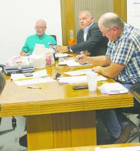 (L-R) Precinct 1 Commissioner Gary Oliver, Jack County Judge Keith Umphress and Precinct 4 Commissioner Terry Ward listen to Sheriff Thomas Spurlock during a special commissioners court meeting Monday, July 3. Spurlock was introducing new JCSO personnel. Photo/Brian Smith