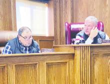 County Judge Keith Umphress, right, gives further explanation to what the sheriff’s department is asking for while Commissioner Kenny Salazar listens during the Monday, Feb. 12 commissioners court meeting. Photo/Brian Smith