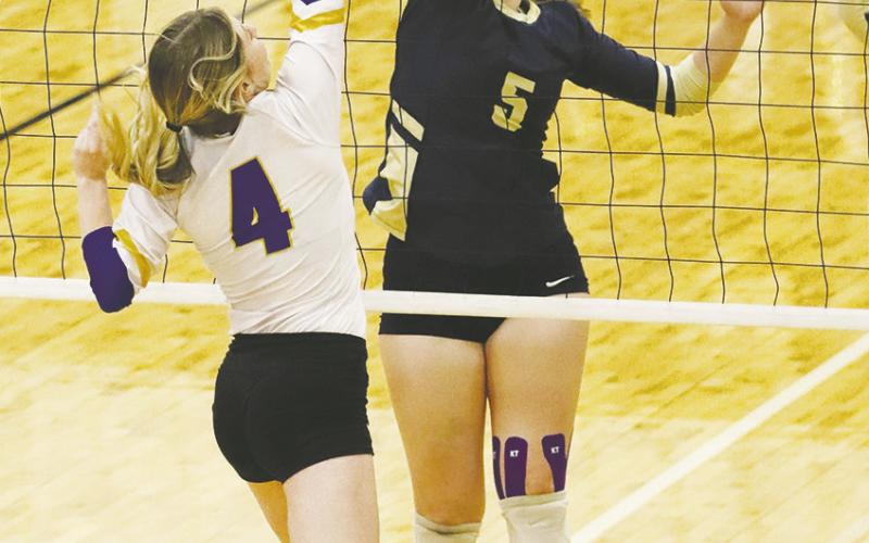 Perrin’s Makenna Mathis (5) looks for the kill against Bryson’s Tracy Hauger during a recent match. Bryson swept past Garner in bi-district action Tuesday, Nov. 1. Photo/Dena Turner