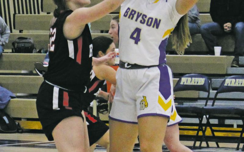 Riley Valliant (4) is fouled by a defender during a recent game. Valliant and her Cowgirl teammates won their District 21-A opener, 39-38, over Newcastle last Tuesday. Photo/Brian Smith