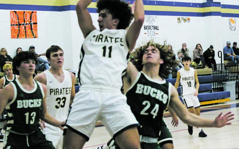 Perrin’s Dayne Thompson (11) comes down with a rebound during second-half action Thursday, Dec. 15 with Breckenridge. Thompson and company fought back twice late but wound up on the short end with the Buckaroos. Photo/Brian Smith