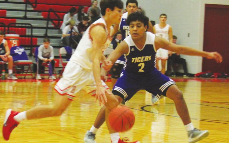 Tigers fall to Holliday, 50-37