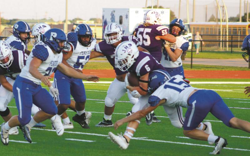 Luke Sams (6) looks for running room. Sams led the Tiger rushing attack with 54 yards as Jacksboro won its District 5-3A Division II opener over Eastland, 53-6. Photo/Brian Smith