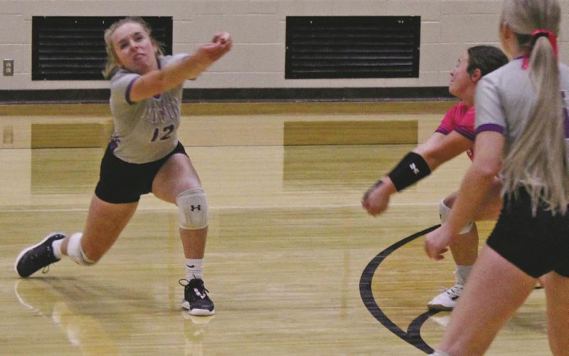 Emma Gray (12) bumps a return while both Avery Bennett, center, and Kylie Tullous came in to help during the Oct. 5 match with Vernon. The Tigerettes lost a five-game thriller to the Lady Lions. Photo/Brian Smith