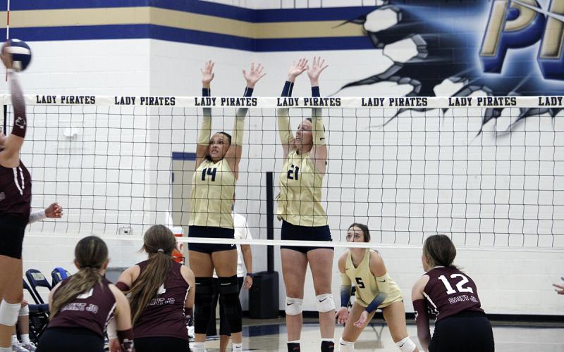 Baylee Meadows (Left) and Kannan Collier (Right) go up for a block. Meadows was key defensively at the front of the net. JHG file photo