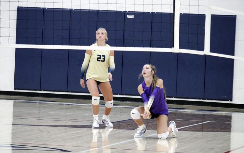Bea Adams (Left) and Michelle Akin (Right) defend a ball in their zone. The Lady Pirates beat the Ladycats in three sets. JHG file photo