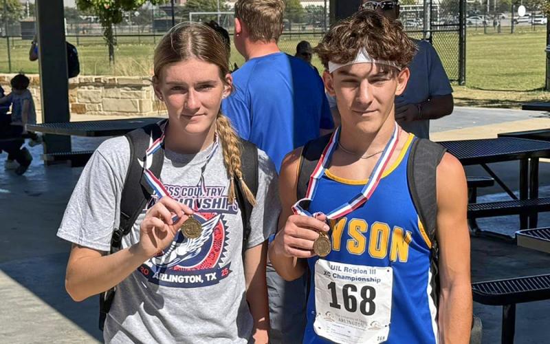 Joslyn Whitfill and Ty McComack pose with their medals Monday, Oct. 20 after competing in the 1A Region III Cross Country Championship in Grand Prairie. McComack and Whitfill both qualified for the state meet, with sixth and ninth place finishes, respectively. (Contributed photo/Bryson ISD)