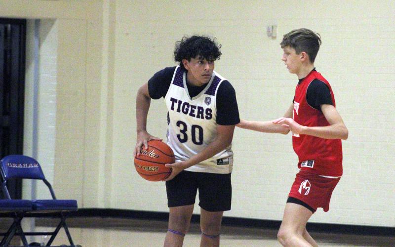 Gio Aldada looks to pass the ball to an open man Tuesday, Sept. 30, during fall league BB in Graham. Aldada got in on the scoring barrage for the Tigers in game two leading to a blowout victory. Photo/Alex Havardansky