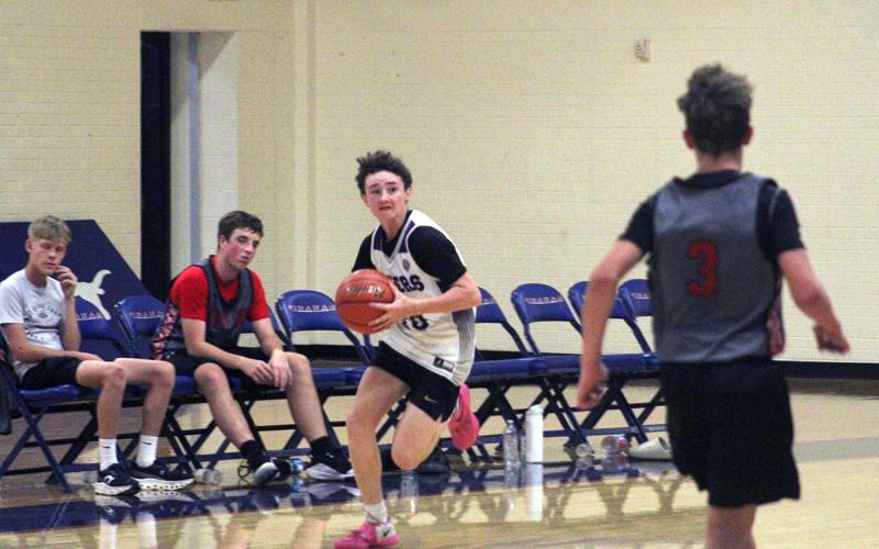 Jacob Idell looks to pass the ball up the court for the Tigers Tuesday, Sept. 30. Idell helped the Tigers go 2-0 on the night in Graham for fall league basketball. Photo/Alex Havardansky