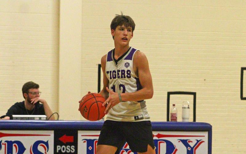 Brayden Rockey looks for an open man up court Tuesday, Sept. 30, in Graham fall league basketball. The Tigers went 2-0 on the night against Olney and Wichita Falls Christian. Photo/Alex Havardansky