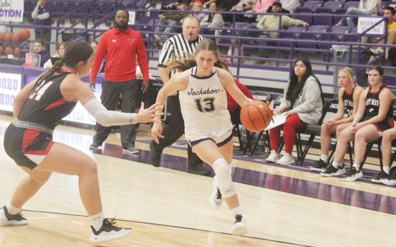 Starr Wesson (13) looks to head toward the baseline in the Tigerettes’ game with Eastland. Jacksboro suffered a 47-41 home court loss to the Lady Mavs. Photo/Brian Smith