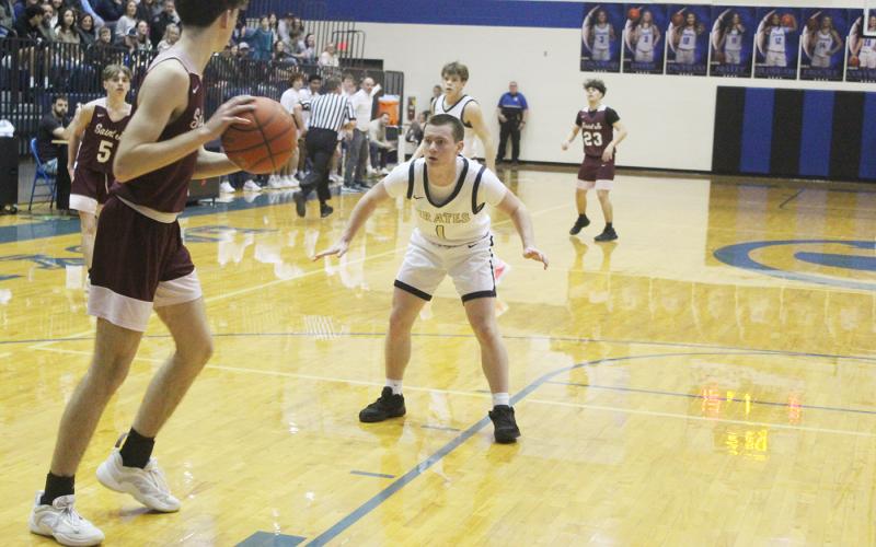 Hunter Walker plays defense on the Saint Jo player during Perrin’s 75-38 win over the Panthers in a Class A Division I bi-district matchup. Photo/Brian Smith