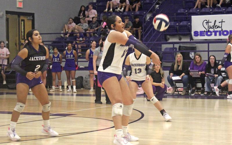 Lilly Webster returns a serve during game one of the match with Iowa Park. Jacksboro lost in four sets Tuesday, Oct. 22. Photo/Brian Smith