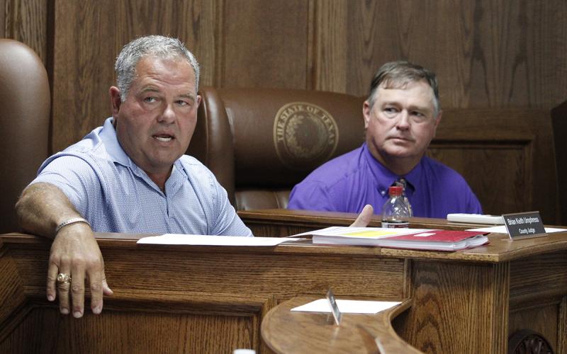 Jack County Judge Keith Umphress (left) says the constable’s office needs help. Commissioner Henry Birdwell, Jr. asks how the county will pay for it and who will supervise the position. Photo/Ashley Anderson