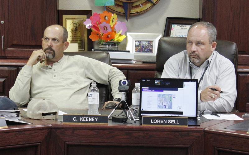 Perrin-Whitt School Board President Chris Keeney and Superintendent Loren Sell review options before selecting a $28.2 million bond package, up for vote in November. Photo/Ashley Anderson