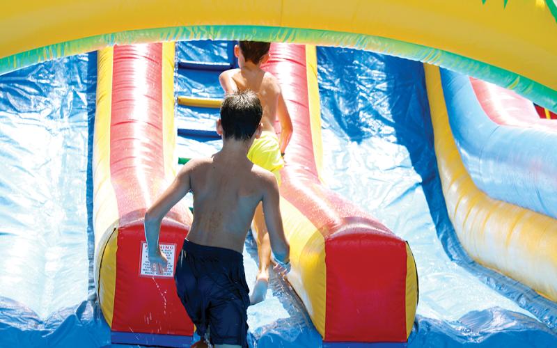 Kids play in water-filled bounce houses to stay cool at TNT Fest last year. Food, fun and entertainment returns to the Jack County Courthouse square Saturday, June 27 in Jacksboro. Archive photo