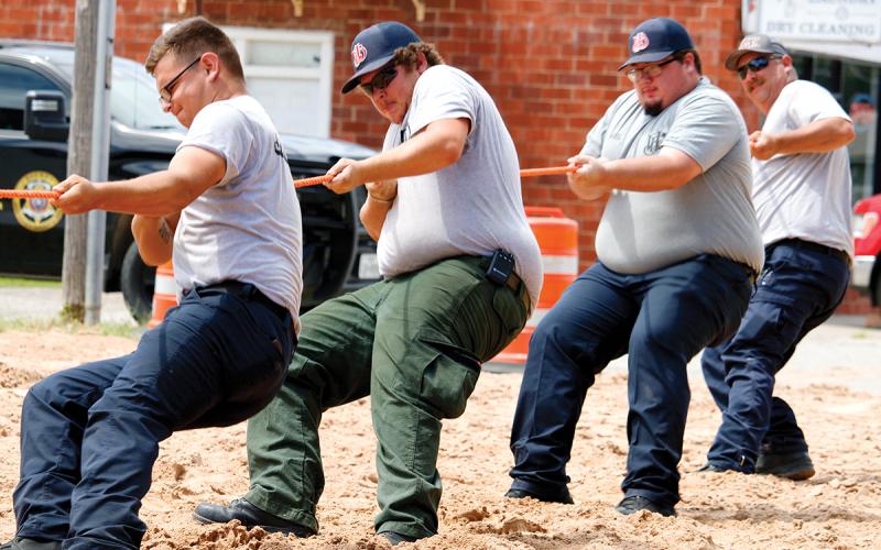 Members of the Jacksboro Fire Department put their weight into the tug-of-war competition at TNT Fest in 2025. The annual event returns Saturday, June 27 on the courthouse square in Jacksboro. Archive photo