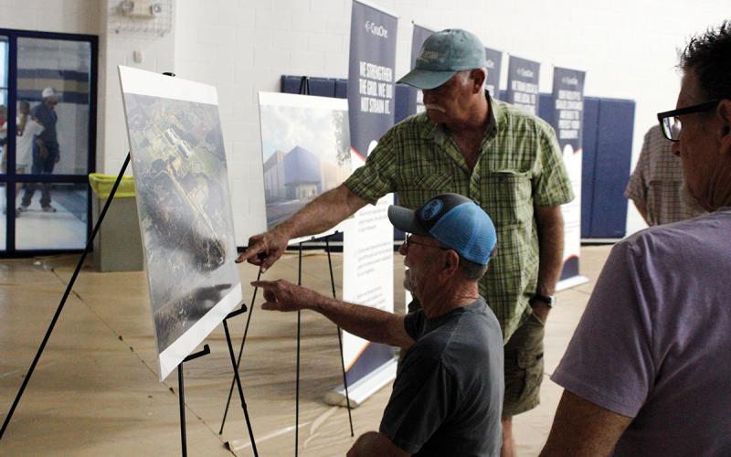 Local residents point at a map Thursday, May 28 at a community meeting in Perrin held by CyrusOne. The county will consider in July designating a reinvestment zone and approving a tax abatement agreement for the construction of a data center campus in southeastern Jack County. Photo/Ashley Anderson