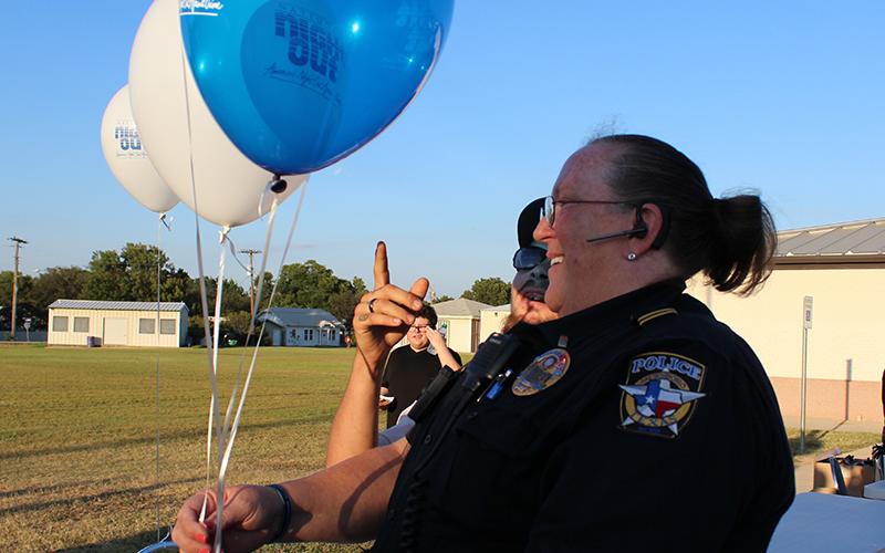 Jacksboro Police Lt. Connie McGee hands out balloons during the 2016 National Night Out event. This year’s National Night Out will be Tuesday from 6-8 p.m. at the Jacksboro Middle School.