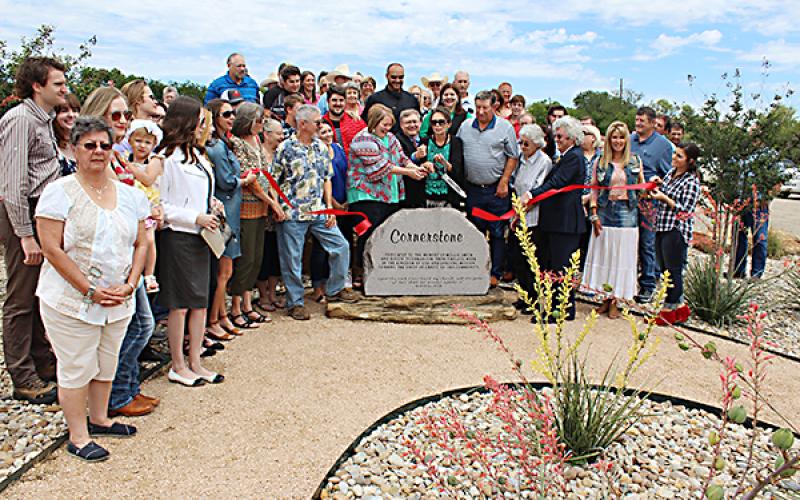 Cutting the ribbon on the Cornerstone Center are the descendants of Jesus Name Church creators Mollie Smith and Dollie Tilghman.