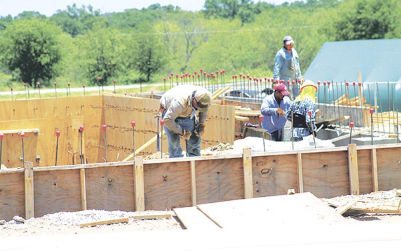 Workers took advantage of the dry weather Wednesday to continue work on the FCH Wellness Center. Recent rains have delayed construction but FCH officials are still hoping for a mid-Fall completion.