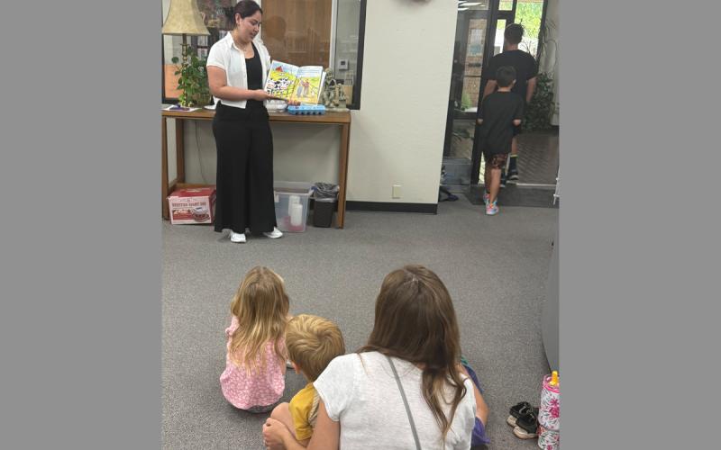 Jacksboro High School FCCLA and FFA member Lilly Lopez reads to a group of kids Tuesday, June 2 at the Gladys Johnson Ritchie Public Library. The summer reading program is open every Tuesday to kids ages 4-12 through June 30. Contributed photo