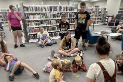 Kids gather 4-H sponsor Bailey Clack as she talks about hatching chicks. Jack County 4-H is partnering with the Gladys Johnson Ritchie Public Library to host the summer reading program throughout June. Contributed photo