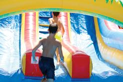 Kids play in water-filled bounce houses to stay cool at TNT Fest last year. Food, fun and entertainment returns to the Jack County Courthouse square Saturday, June 27 in Jacksboro. Archive photo