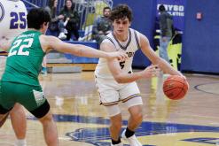 Bryson Cowboy Caleb Allen makes his way around a Newcastle defender in January. Allen was selected to play for the East Team in the Six-Man Football Coaches Association Boys Basketball All-Star Game in Wichita Falls. Photo/Ashley Anderson
