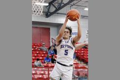 Bryson senior Caleb Allen grabs the rebound against Newcastle in February. Allen played for the boys East team in the Oil Bowl All-Star Games in Wichita Falls, helping his team to a 78-72 victory. Photo/Ashley Anderson