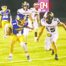 Bryson’s Nate Jackson (1) looks for running room during the Cowboy’s 56-44 homecoming night win Friday, Sept. 27 over Woodson. Jackson had six touchdowns in the victory. Photo/Brian Smith
