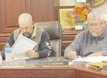Perrin-Whitt CISD Superintendent Cliff Gilmore, right, gives his monthly report on the finances while Board President Chris Keeney listens in during the board’s Thursday, Dec. 21 meeting. Photo/Brian Smith
