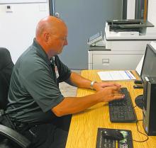 EMT Tim Gulbranson works at a computer. Gulbranson recently celebrated his 37th year of working as an EMT and has been with Faith Community Hospital Emergency Medical Services for the last six months. Staff photo