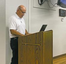 James Obermyer, with HydraPro, speaks to Jacksboro City Council members during their Monday, Dec. 12 meeting. Obermyer gave an update on how the automated water meter transition was going. Photo/Brian Smith