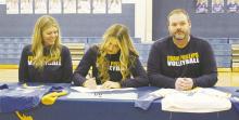 Bryson senior Riley Valliant, center, signs a national letter of intent to play volleyball at Frank Phillips College in Borger during a ceremony held Thursday, Feb. 9. Also pictured are her parents, LaTasha Kirby, left, and Gary Kirby. Photo/Brian Smith