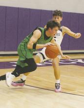 Eric Pizana makes life difficult defensively for the Iowa Park defender during the Friday, Jan. 24 game. Photo/Brian Smith