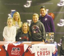Jacksboro High School senior Emma Gray, front row center, signed her national letter of intent to play softball for Hill College in Hillsboro during a ceremony Friday afternoon. Playing collegiate softball has been a dream of Gray since 5th grade. Photo/Brian Smith