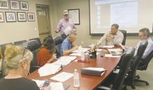 David Sloan, back left, speaks to Bryson ISD board members about upgrading both baseball and softball facilities during the Monday, April 21 meeting. Photo/Brian Smith