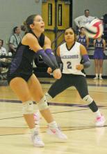 Lileigh Taylor bumps a return with Lily Perez coming in to assist during Jacksboro’s win Tuesday, Sept. 24 over Bowie. Photo/Brian Smith