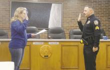 Jacksboro City Secretary Shalyn Burritt swears in Adam Rydlinski as JPD’s new sergeant Thursday, Dec. 21. Photo/Brian Smith
