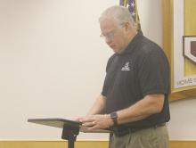 Mike Edgin presents the annual financial report to Jacksboro ISD board members during the Monday, Oct. 14 meeting. The district received a clean audit. Photo/Brian Smith