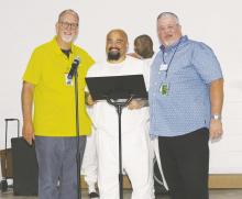 Matthew Daniels, center, is the 75,000th graduate of the Bridges to Life program. He was honored by Bridges to Life DFW Regional Coordinator Charles Fisher, right and Lindsey State Jail Chaplain Fowler during a Wednesday, June 7 ceremony. Photo/Brian Smith